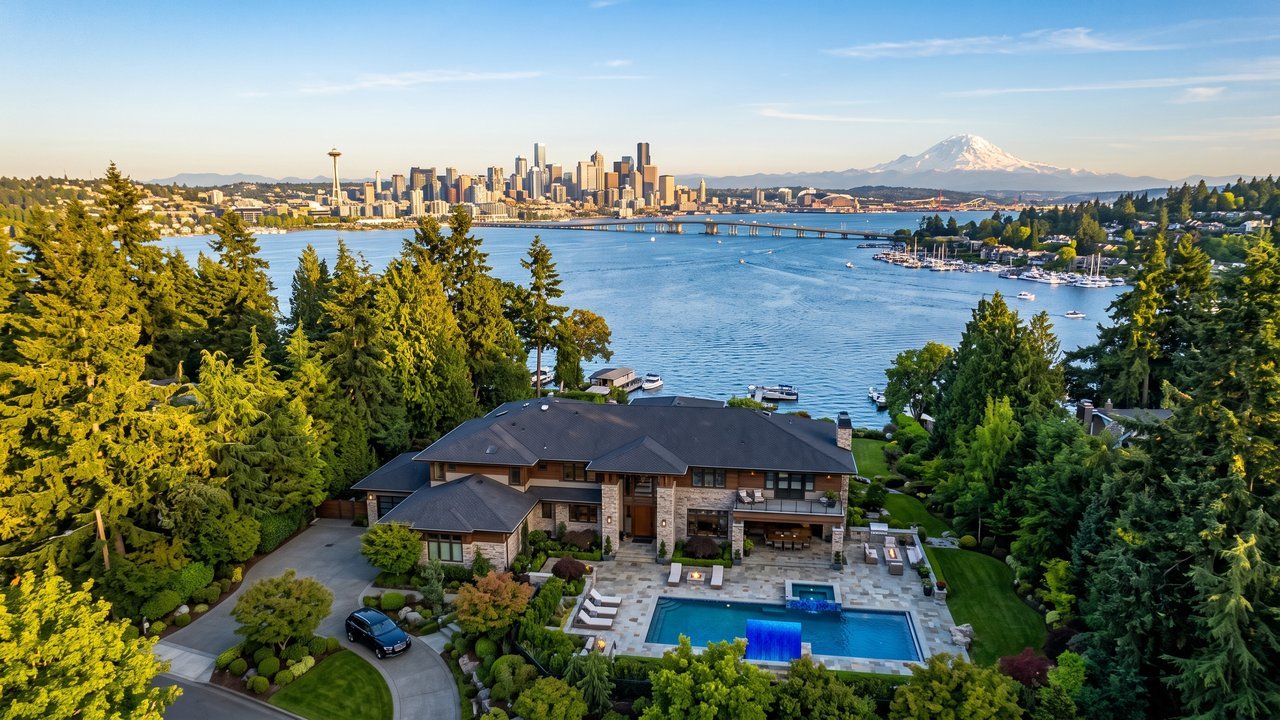 Aerial drone photography of a luxury Bellevue home with Lake Washington and Seattle skyline in background